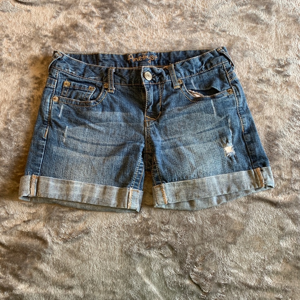 Slightly distressed rolled jean shorts